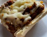 A picture of step 3 of Sloppy joes stuffed french bread.