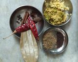 A picture of step 3 of Palak panch dal khichdi tempered with burnt garlic.