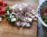 A picture of step 2 of Egg tomato onion omlette.