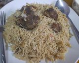 A picture of step 9 of Mutton Yakhni Pulao.  With dehi and Tea.
