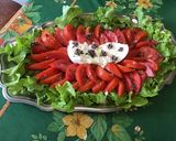 Une image de l'étape 7 de Feuille de chêne aux tomates coeur de bœuf, burrata et fleurs de basilic.