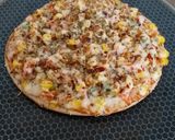 A picture of step 9 of Cheesy Mexican Veg Pizza.