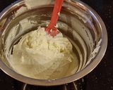 A picture of step 10 of Vanilla Lemon Raspberry Layer Cake with Whipped Cream Buttercream Frosting.