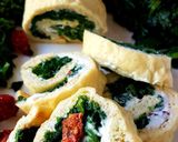 A picture of step 7 of Egg White Frittata Roll with Ricotta, Spinach, and Sun-Dried Tomatoes.