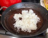 A picture of step 3 of Choco Biko with white coconut shreds and toasted coconut.