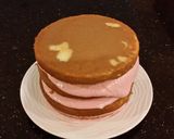 A picture of step 28 of White Chocolate Layer Cake Filled with Strawberry Mousse and Frosted with Whipped Strawberry White Chocolate Ganache.