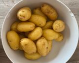 A picture of step 1 of Hasselback truffle roasted potatoes.