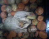 A picture of step 1 of Baked Rosemary chicken with carrots and potatoes.