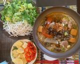 A picture of step 4 of Bún Riêu Ốc (Vietnamese Snail and Crab Noodle Soup).
