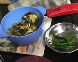 A picture of step 1 of Muri Ghonto: Bengali Yellow Rice with Fish Head.