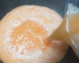 A picture of step 2 of Immune Booster Orange Carrot Juice.