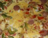 A picture of step 5 of Sauted veggies, sausage mixed in eggs and bakefried.