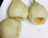 A picture of step 2 of Poached pears with chocolate and ice-cream.
