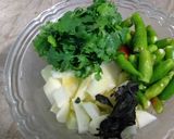 A picture of step 1 of Raw mango fried chutney.