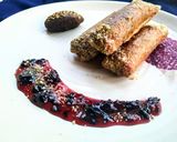 A picture of step 9 of Znoud-el-sit with creamy choco hummus filling and red grape sauce.