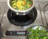 A picture of step 2 of Paneer corn capsicums in white greavy.