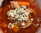 A picture of step 3 of Crockpot Buffalo Chicken Soup.