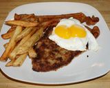 Foto del paso 7 de la receta: MILANESA A CABALLO CON RIENDAS. JON STYLE