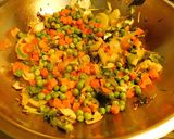 A picture of step 3 of A novel recipe- ravioli/samosa  made with rice paper stuffed with veggies.