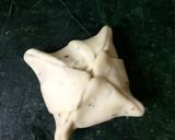 A picture of step 6 of Flower samosa with peas.