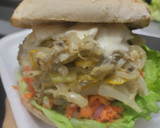 Foto del paso 13 de la receta: Sándwich con muchos vegetales y pollo🥙🥯🧅🍆🍗🥪