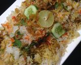 A picture of step 2 of ChatpatiBombay biryani with tang twist, yogurt salad, mango, apple cubes.