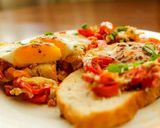 A picture of step 5 of North African-Style Poached Eggs with Spiced Tomato Sauce.