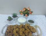 A picture of step 3 of Sabudana vada donut with sweet curd and mint chutney.