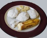 A picture of step 5 of Sweet Puttu (steamed rice cake from Kerala) with coconut.