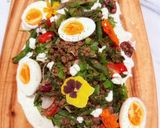 A picture of step 9 of Kinda Nicoise with Fried Green Beans, Roasted Kale, Lentils, Boiled Eggs and Caper Mayo.