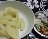 A picture of step 1 of Chilli garlic potatoes.