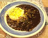 Foto del paso 10 de la receta: Calamares de potera en salsa de verduras y tinta con arroz blanco y escamas de naranja