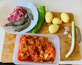 A picture of step 1 of Kimchi, Pork, Prawn, Chili and Potato Stew.