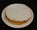 A picture of step 26 of White Layer Cake with a Raspberry Swirl Cheesecake center layer and a Raspberry Cream Frosting.
