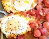A picture of step 9 of Shakshuka with hot dogs.