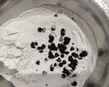 A picture of step 3 of Eggless Banana Cake with chocolate chips.