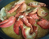 Foto del paso 10 de la receta: Arroz caldoso de bogavantes y langostinos al whisky con coquinas al ajillo