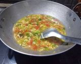 A picture of step 3 of Singapore curry noodles soup.