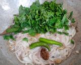 A picture of step 5 of Katla fish biryani in electric rice cooker.