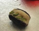 A picture of step 3 of Dates filled with almond fudge.