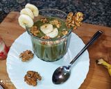 A picture of step 4 of Banana Moringa Yakult Milkshake topped with Walnuts.