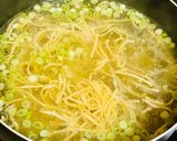 A picture of step 5 of Egg noodles in chicken broth.