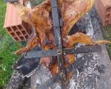 Foto del paso 3 de la receta: Asado a la cruz de pollo y chori de puro cerdo al gancho