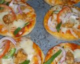 A picture of step 2 of Mini pizza with speghetti.