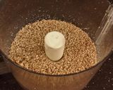 A picture of step 7 of Toasted Butter Pecan Layer Cake with Whipped White Chocolate Cream.