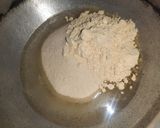 A picture of step 1 of Yellow Suji Halwa.