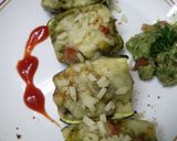A picture of step 7 of Zucchini stuffed with cheesy Guacamole.