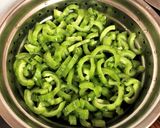 A picture of step 1 of Snake Gourd Poriyal.