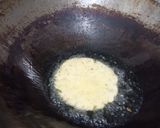 A picture of step 5 of Khatta Meeta Kaddu (pumpkin) with Samak poori.