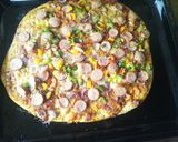 A picture of step 6 of Smokie pizza.